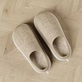Comfortable Beige Linen Slippers With White Soles On Herringbone Wooden Floor