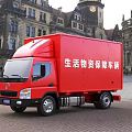 Red Life Supplies Support Vehicle Parked In Square With Ancient Buildings