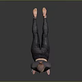 Woman Practicing Yoga Pose In Gray Athletic Outfit On Smooth Dark Floor