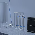 Stainless Steel Piping System with Blue Valves and Adjacent Storage Tank and Black Cabinet