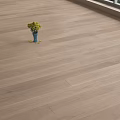 Wooden Floor With Blue Vase Holding Yellow Flowers Near Window And Green Scenery Outside