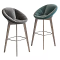 Modern Bar Stools With Green And Beige Padded Seats And Wooden Legs