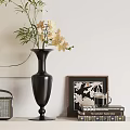 Black Vase With Yellow Orchid Flowers Framed Art Books And Cup On White Wall