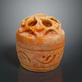 Intricate Orange Stone Sculpture Carving With Hollow Top And Decorative Patterns