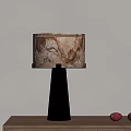 Minimalist Modern Table Lamp With Silver Metal Base And Marble Texture Shade On Wooden Table