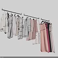 Various Styles Clothes Hanging On Hangers With Different Colors And Fashion Designs