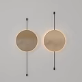 Modern Round Wall Lamps With Beige Shade And Black Frame Emitting Warm Light