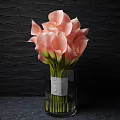 Pink Calla Lilies in Transparent Vase with Gray Ribbon Against Black Wavy Textured Wall