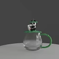 Transparent Glass Cup With Green Handle And Panda Doll Holding Small Box