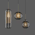Modern Pendant Lights With Transparent Glass Shades Gold Metal Hollow Details And Varied Shapes