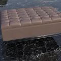 Elegant Brown Tufted Ottoman With Stylish Black Metal Legs On Marble Floor