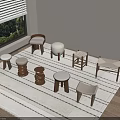 Various Designed Stools Arranged On Striped Rug Near Window With Green Plants