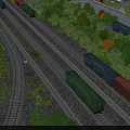 Colorful Freight Train With Green And Red Cars On Rail Tracks Surrounded By Trees