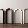 Various Colored Arch Frames Against Light Wall With Wooden Floor