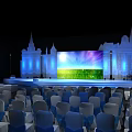 Blue Illuminated Stage Setup With Colorful Background Screen And Arranged Audience Seats