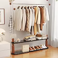 Modern Clothes Rack with Hanging Neutral Tones Apparel Stacked Clothes Handbags and Shoes
