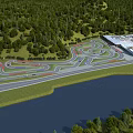 Aerial View Planning of Winding Race Track with Forest Water and Adjacent Building