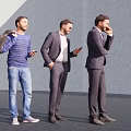 Three Men Standing Together in Modern Urban Setting Using Phones and Carrying Bags
