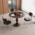 Modern Dining Area With Round Wooden Table Three Chairs Window Blinds And Potted Plant