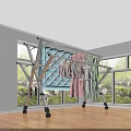 Foldable Clothes Drying Rack With Wheels Holding Baby Clothes Towels Quilt In Room With Window