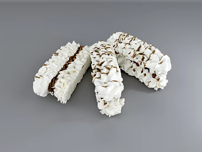 Long Shaped Desserts With White Cream Icing And Brown Filling Topped With Brown Crumbs 3d model