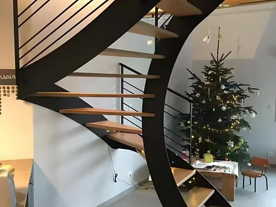 Modern Spiral Staircase Interior With Metal Railings Wooden Steps And Decorated Christmas Tree 3d model