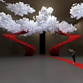 Art Installation Featuring Red Spiral Staircase With White Cloud Like Decorations And Red Carpet