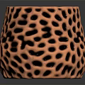 Metallic Copper Vase With Intricate Honeycomb Texture On Black Background And Reflection