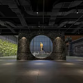 Industrial Interior Space Featuring Circular Stone Wall With Golden Statue And Green Plants