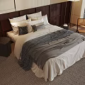 Stylish Double Bed With Dark Wooden Headboard Plush Pillows And Grey Throw Blanket