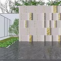 Modern Grey Feature Wall With Gold Decorative Blocks Lush Greenery And Reflective Water