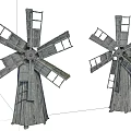 Two Rustic Wooden Windmill Architectural Components With Ladder And Rotating Blades