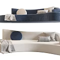 Navy Blue And Beige Curved Sectional Sofa With Round Pillows And Throw Blanket 3d model