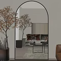 Large Arched Mirror Reflecting Cozy Living Room With Sofa Pillows And Decorative Tree
