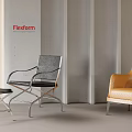 Modern Leisure Chairs With Gray And Orange Upholstery And Black Footstool In Contemporary Interior