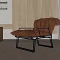 Modern Single Sofa With Brown Leather And Metal Frame In Contemporary Living Interior