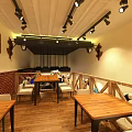 Restaurant Interior With Brick Wall Wooden Counter Stools And Nautical Decor