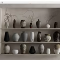 Ceramic Vessels on Multiple Shelves Display Various Shapes Colors and Textured Designs in Minimalist Style