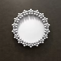 Circular Mirror With Decorative Yellow And White Beads Reflecting Bedroom Bed And Pillows