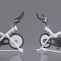 Modern Stationary Exercise Bikes With White Frame Black Seat And Red Accents