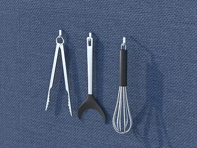 Essential Kitchen Utensil Set Including Tongs Spatula And Whisk On Blue Fabric Background 3d model