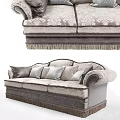 Elegant Three Seater Sofa With Patterned Upholstery Fringe Trim And Decorative Pillows