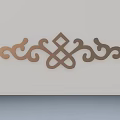Ornate Decorative Carving with Intricate Curls and Geometric Patterns in Golden Hue