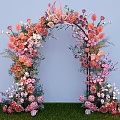 Floral Arch Photo Spot With Pink Orange White Flowers Light Blue Backdrop And Green Grass