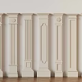 White Decorative Columns With Various Designs Arranged On Wooden Floor
