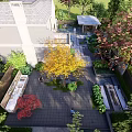 Modern Garden Landscape Around House With Colorful Trees Stone Paths Green Plants And Patio Area