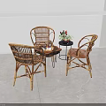 Wicker Leisure Chairs With Small Round Table In Indoor Relaxation Space