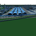Large Scale Industrial Plant With Piping Systems Buildings Surrounding River And Roads
