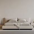 Minimalist Modern Double Bed With Upholstered Headboard And Nightstands With Decorative Vases And Artwork