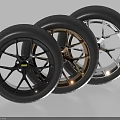 Three Automotive Tires With Black Gold Silver Rims And Different Designs